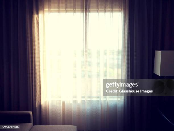 hotel room curtains and sunlight - window curtains stock pictures, royalty-free photos & images