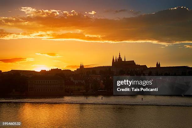 sunset in prague, st. vitus cathedral in the back, prague, czech republic, europe - the moldau river stock pictures, royalty-free photos & images