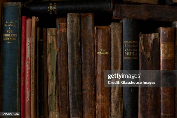 row of old books - book spine stock pictures, royalty-free photos & images