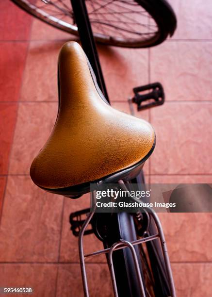 leather bicycle seat, high angle view - fahrradsattel stock-fotos und bilder