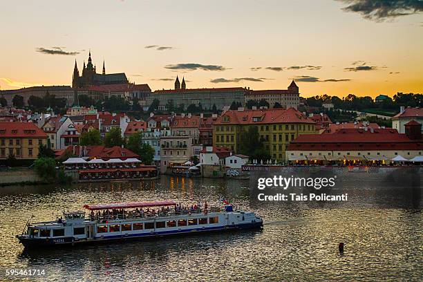 the st. vitus cathedral in the back, cruise in the vltava river (moldau) in prague, czech republic - tancici dum stock pictures, royalty-free photos & images