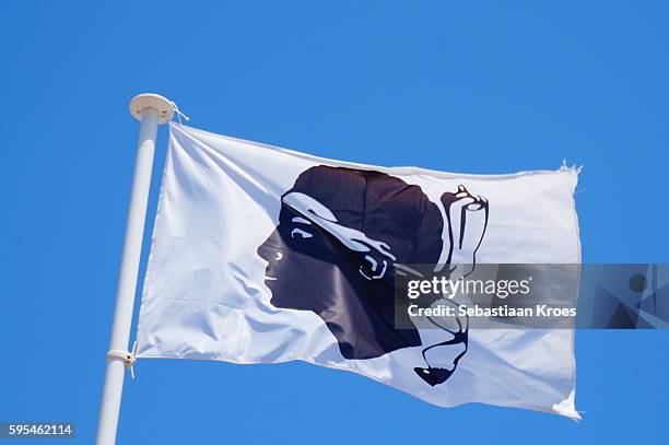 corsican flag in the wind, macinaggio, france - corsican flag stock pictures, royalty-free photos & images