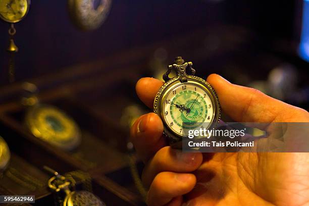 man checking an old mechanic pocket watch - the moldau river stock pictures, royalty-free photos & images