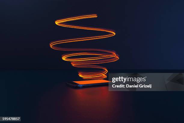 smart phone with an energy field - lights long exposure stock pictures, royalty-free photos & images