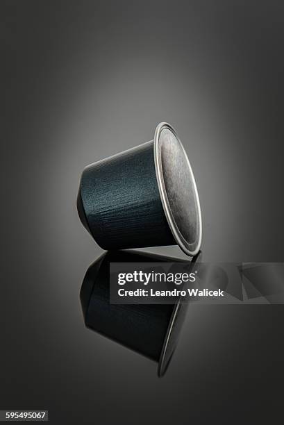 studio shot of a single espresso coffee pod - coffee capsules stock pictures, royalty-free photos & images