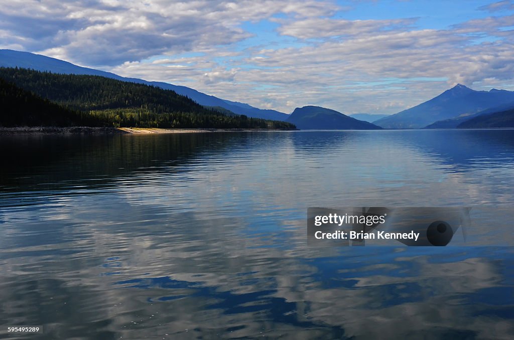 Arrow lakes sky reflection