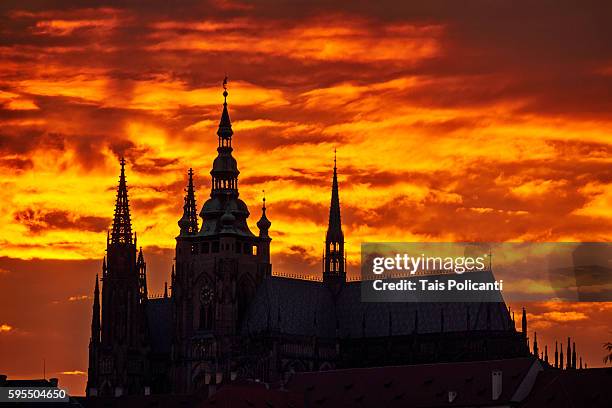 dramatic orange sunset at the st. vitus cathedral in czech republic, europe - the moldau river stock pictures, royalty-free photos & images