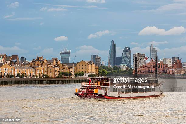 a ferryboat on the thames river from canary wharf - passenger craft stock pictures, royalty-free photos & images