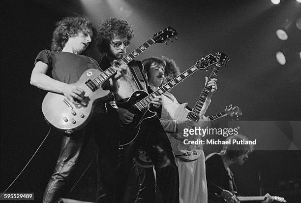 American rock group Blue Oyster Cult all playing guitars on stage, USA, 30th July 1976. Left to right: Allen Lanier, Eric Bloom, Donald 'Buck Dharma'...