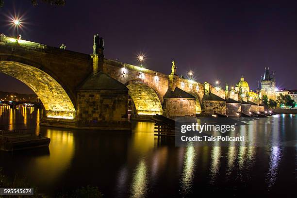 charles bridge(karlův most) long exposure at night in center prague, czech republic, europe - tancici dum stock pictures, royalty-free photos & images