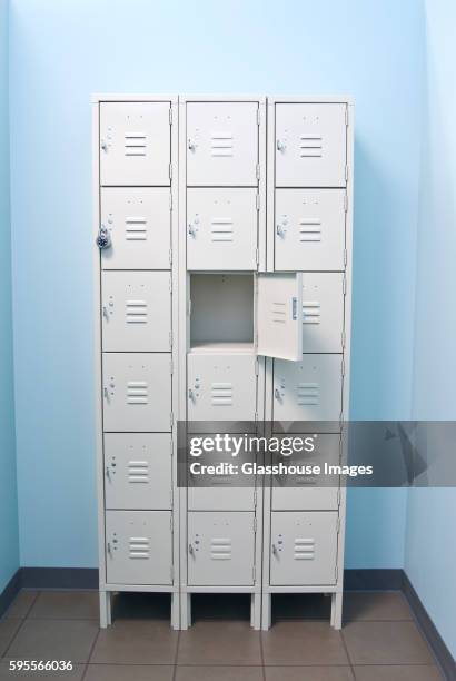 three columns of metal storage lockers with one open door - locker foto e immagini stock