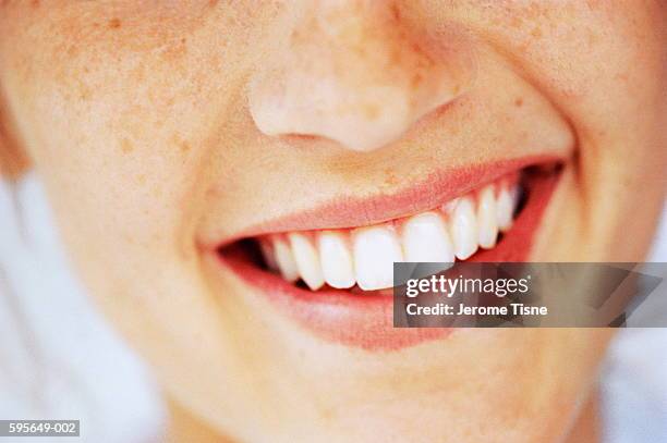 young woman smiling, close-up - woman teeth stock-fotos und bilder