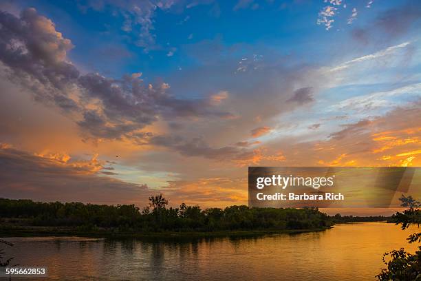 beautiful clouded sky as sun sets over the river - chico stock pictures, royalty-free photos & images