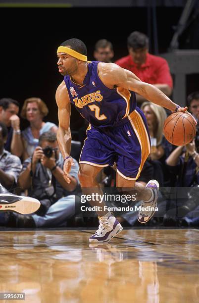 Guard Derek Fisher of the Los Angeles Lakers dribbles the ball during the NBA game against the Miami Heat at the American Airlines Arena in Miami,...