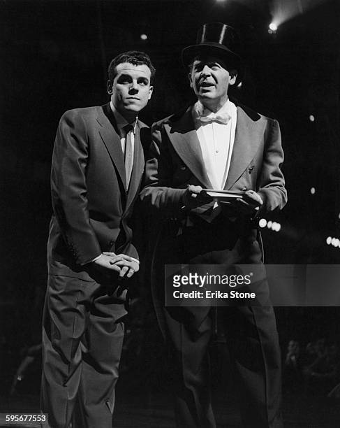 American actor and comedian Milton Berle with singer Julius La Rosa at the opening of a circus in New York City, circa 1952.