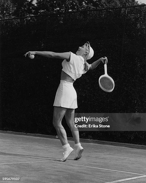 American actress and dancer Ginger Rogers playing tennis in Forest Hills, USA, circa 1950.