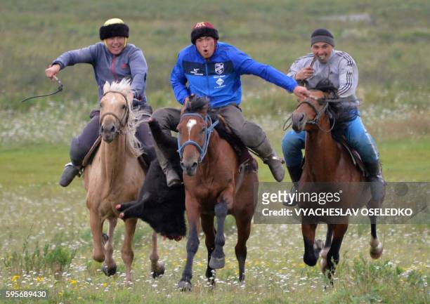 Kyrgyz team riders play the traditional central Asian sport Kok-boru, also known as Buzkashi or Ulak Tartis , during a training session at the...