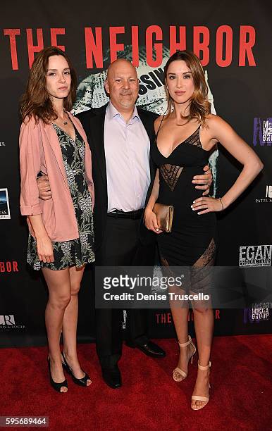 Actress Alex Essoe, executive producer Tony Sgro and actress Melissa Bolona arrive at the premiere of "The Neighbor" at Brenden Theaters at Palms...