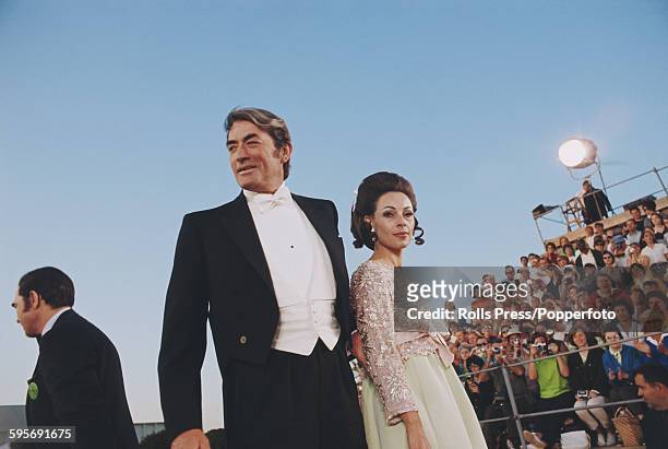 American actor Gregory Peck pictured with his wife Veronique Peck as they attend the 40th Academy Awards at the Santa Monica Civic Auditorium in...