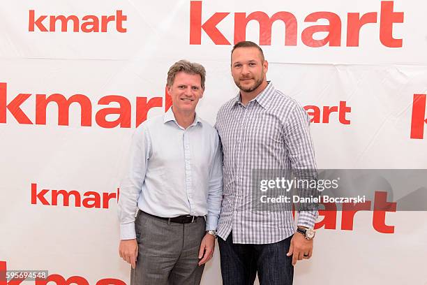 President & Chief Member Officer at Kmart Corporation Alasdair James and Brian Urlacher attend Kmart Celebrates 'A Whole Lotta Awesome' at VIP Member...