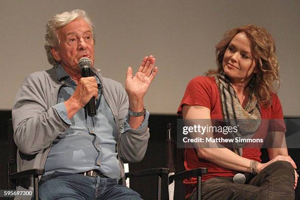 Director Paul Verhoeven and actress Dina Meyer speak onstage during the Arclight Presents screening of "Starship Troopers" at ArcLight Hollywood on...