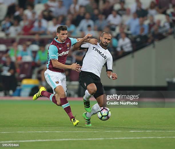 West Ham United's Jonathan` Calleri takes on FC Astra Giurgiu Geraldo Alves during Europa League play-off match between West Ham v FC Astra Giurgiu,...