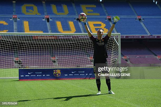 Barcelona's Dutch goalkeeper Jasper Cillessen waves on the pitch during his official presentation at the Camp Nou stadium in Barcelona on August 26...