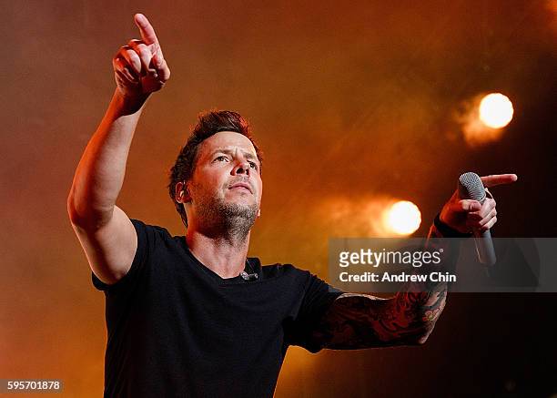 Singer Pierre Bouvier of French-Canadian pop punk band Simple Plan performs onstage during PNE Summer Night Concert Series at PNE Amphitheatre on...