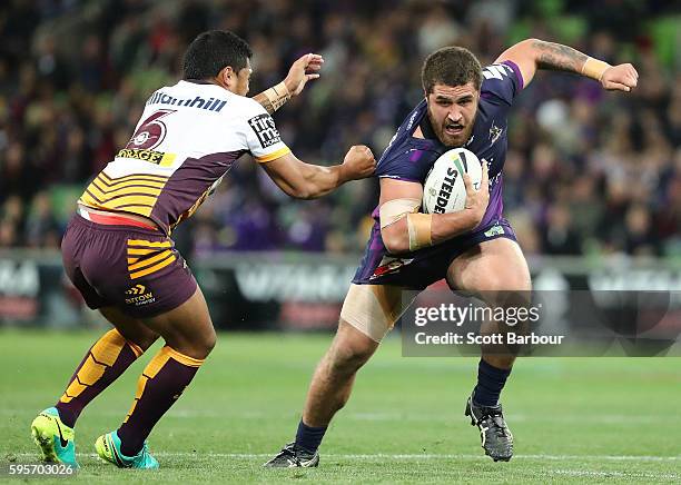 Kenneath Bromwich of the Storm is tackled by Anthony Milford of the Broncos during the round 25 NRL match between the Melbourne Storm and the...