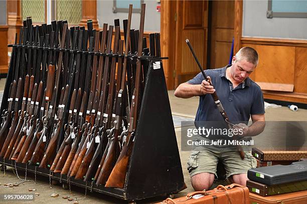 Nigel Budd prepares sporting guns and rifles at Gleneagles Hotel on August 26, 2016 in Aucterarder, Scotland. The annual auction of Fine Modern and...