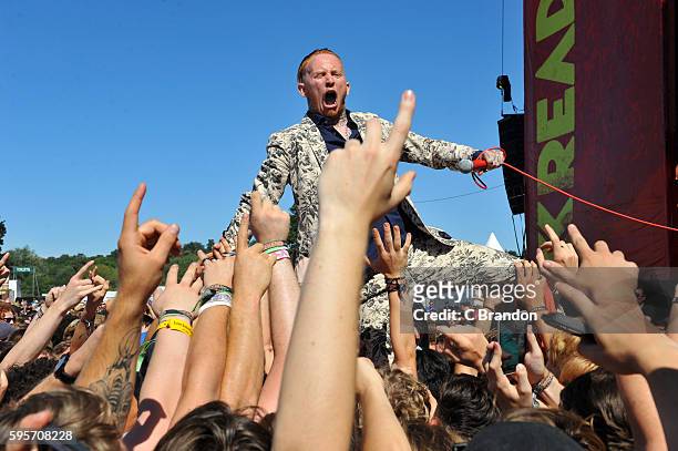 Frank Carter & The Rattlesnakes perform in the crowd during Day 1 of the Reading Festival at Richfield Avenue on August 26, 2016 in Reading, England.