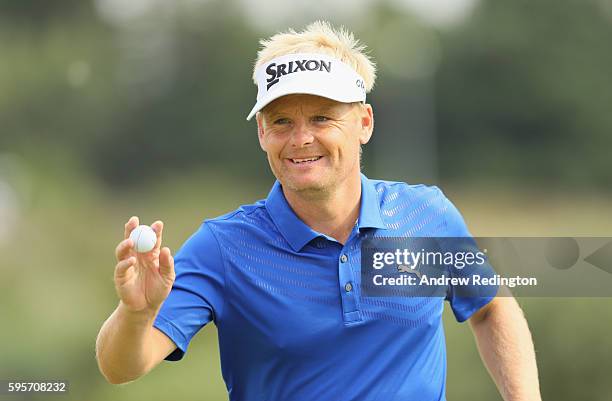 Soren Kjeldsen of Denmark waves to the crowd on the second hole during the second round of Made in Denmark at Himmerland Golf & Spa Resort on August...