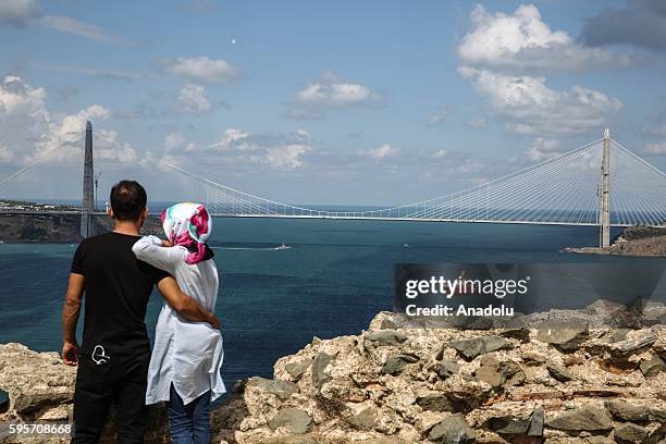 Citizens gather at ancient Yoros Castle, to watch the opening ceremony of newly constructed Yavuz Sultan Selim Bridge, before its opening ceremony...