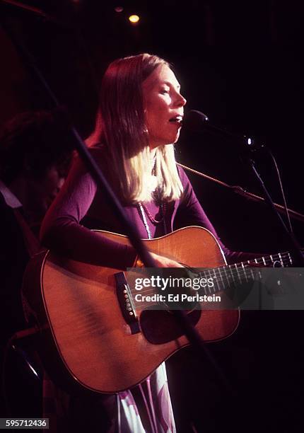 Joni Mitchell performs with The Band during The Last Waltz at Winterland on November 25, 1976 in San Francisco, California.