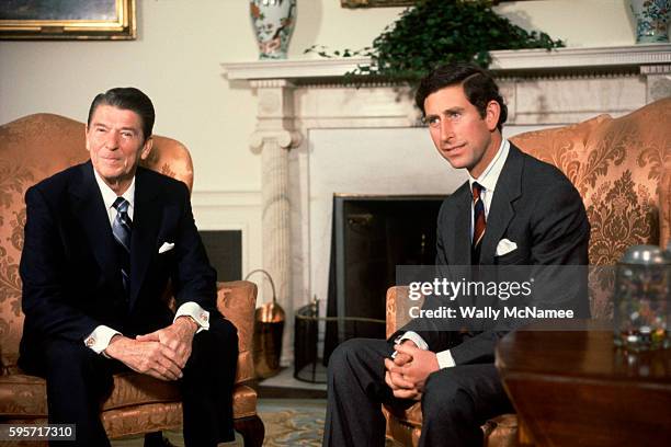 Great Britain's Prince Charles , on a brief visit to Washington, meets with President Ronald Reagan in the Oval Office at the White House.