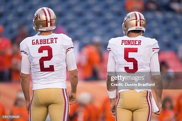 Quarterbacks Blaine Gabbert and Christian Ponder of the San Francisco 49ers stand on the field before a preseason NFL game against the Denver Broncos...