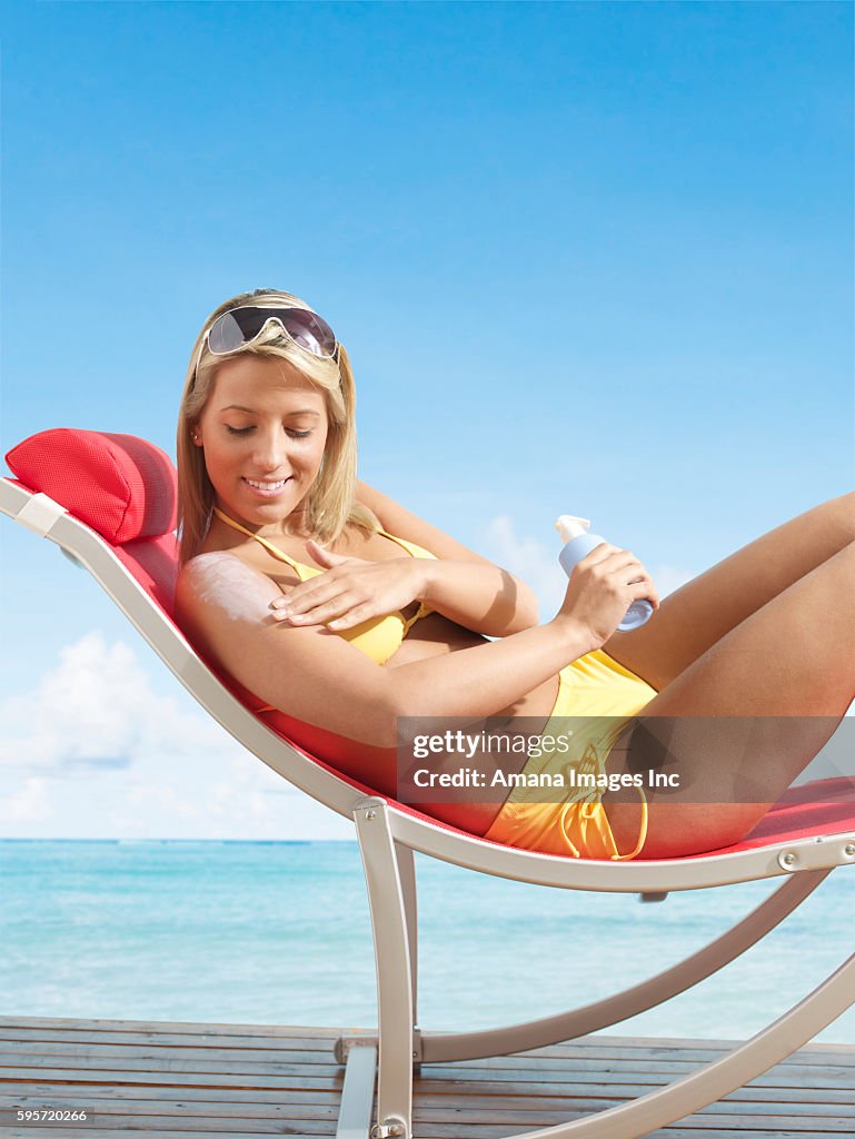 Woman Applying Sun Screen