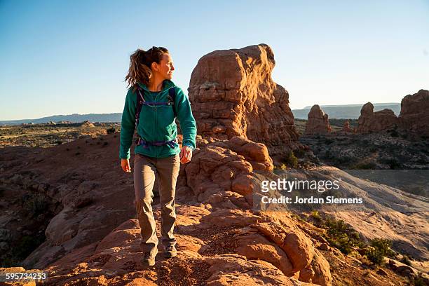 a female on a day hike - moab utah stock pictures, royalty-free photos & images