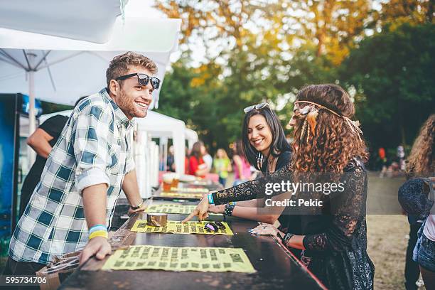 friends drinking beer at summer music festival - traditional festival stock pictures, royalty-free photos & images