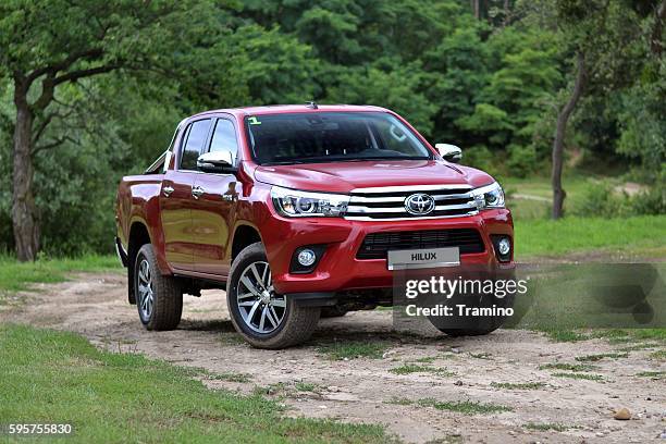 toyota hilux on the road - toyota motor co stock pictures, royalty-free photos & images