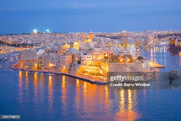 view of birgu at dusk - valletta stock pictures, royalty-free photos & images