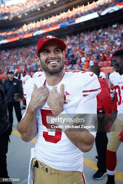 Christian Ponder of the San Francisco 49ers stands on the sideline prior to the game against the Denver Broncos at Sports Authority Field on August...