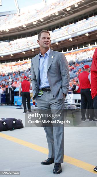 General Manager Trent Baalke of the San Francisco 49ers stands on the sideline prior to the game against the Denver Broncos at Sports Authority Field...