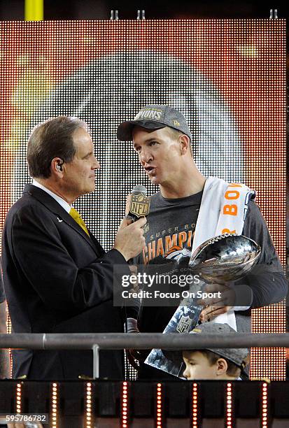 Quarterback Peyton Manning of the Denver Broncos celebrates with the Vince Lombardi Trophy after they defeated the Carolina Panthers during Super...