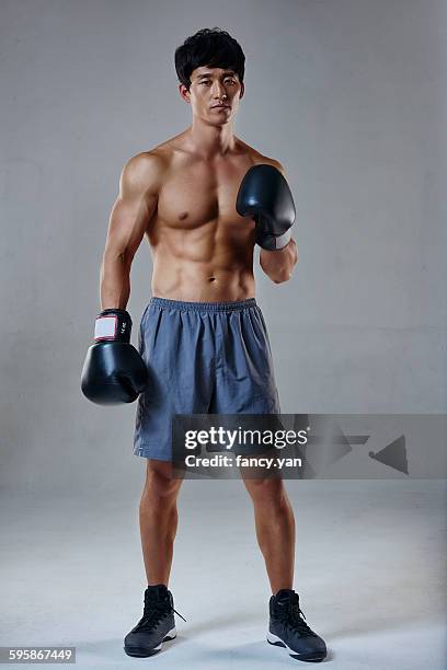 boxing male in sweatpants - boxing stock pictures, royalty-free photos & images