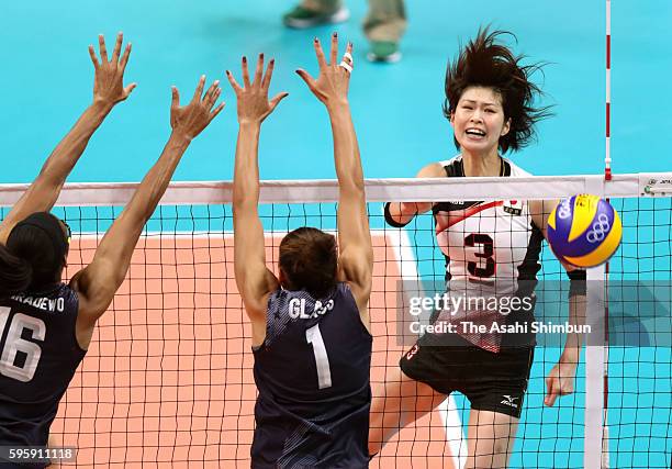 Saori Kimura of Japan spikes the ball during the Women's Quarterfinal match between Japan and The United States on day 11 of the Rio 2106 Olympic...