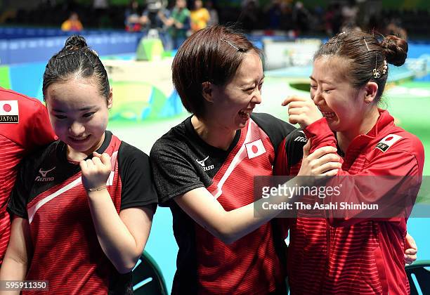 Mima Ito, Kasumi Ishikawa and Ai Fukuhara of Japan celebrate winning the bronze medals after beating Singapore in the Table Tennis Women's Team...