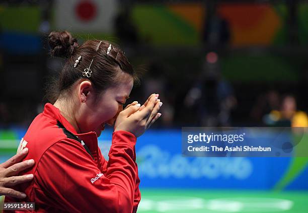 Ai Fukuhara of Japan sheds tears with joy as Japan wins the bronze medals after beating Singapore in the Table Tennis Women's Team bronze medal match...