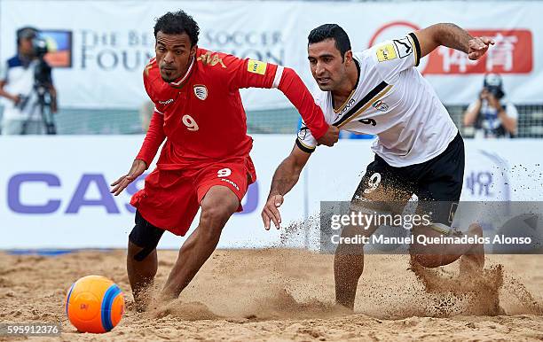 Khalid Khamis of Oman competes for the ball with Mohammadali Mokhtari of Iran during the Continental Beach Soccer Tournament match between Iran and...