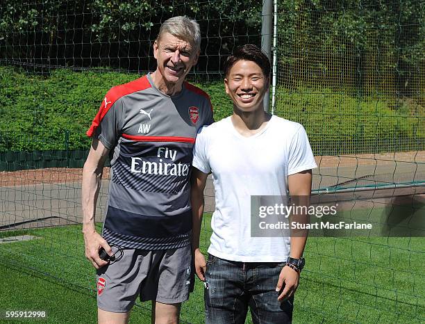 New signing Takuma Asano with Arsenal manager Arsene Wenger at London Colney on July 19, 2016 in St Albans, England.